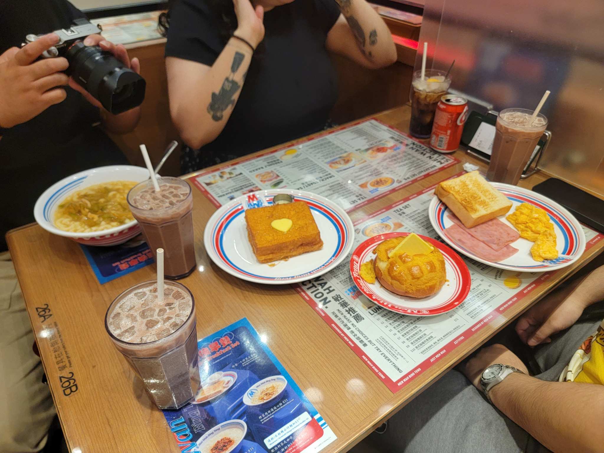 Cha chaan teng breakfast with toast, noodles and iced drinks.