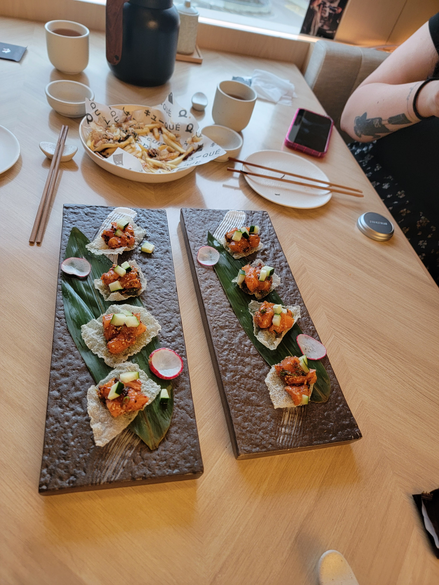 Modern small plates on stone trays.