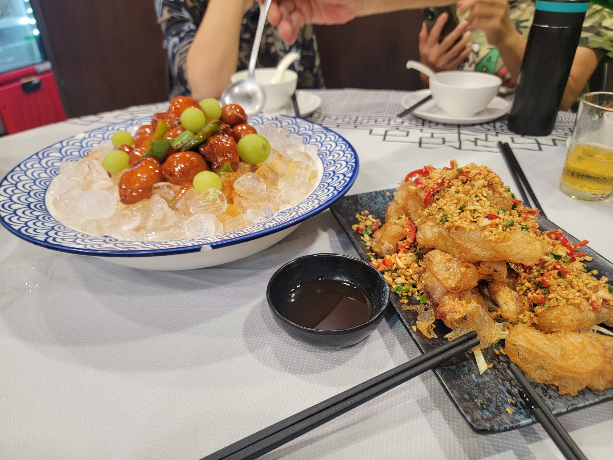 Iced fruit salad and crispy fried fish with chili and garlic.