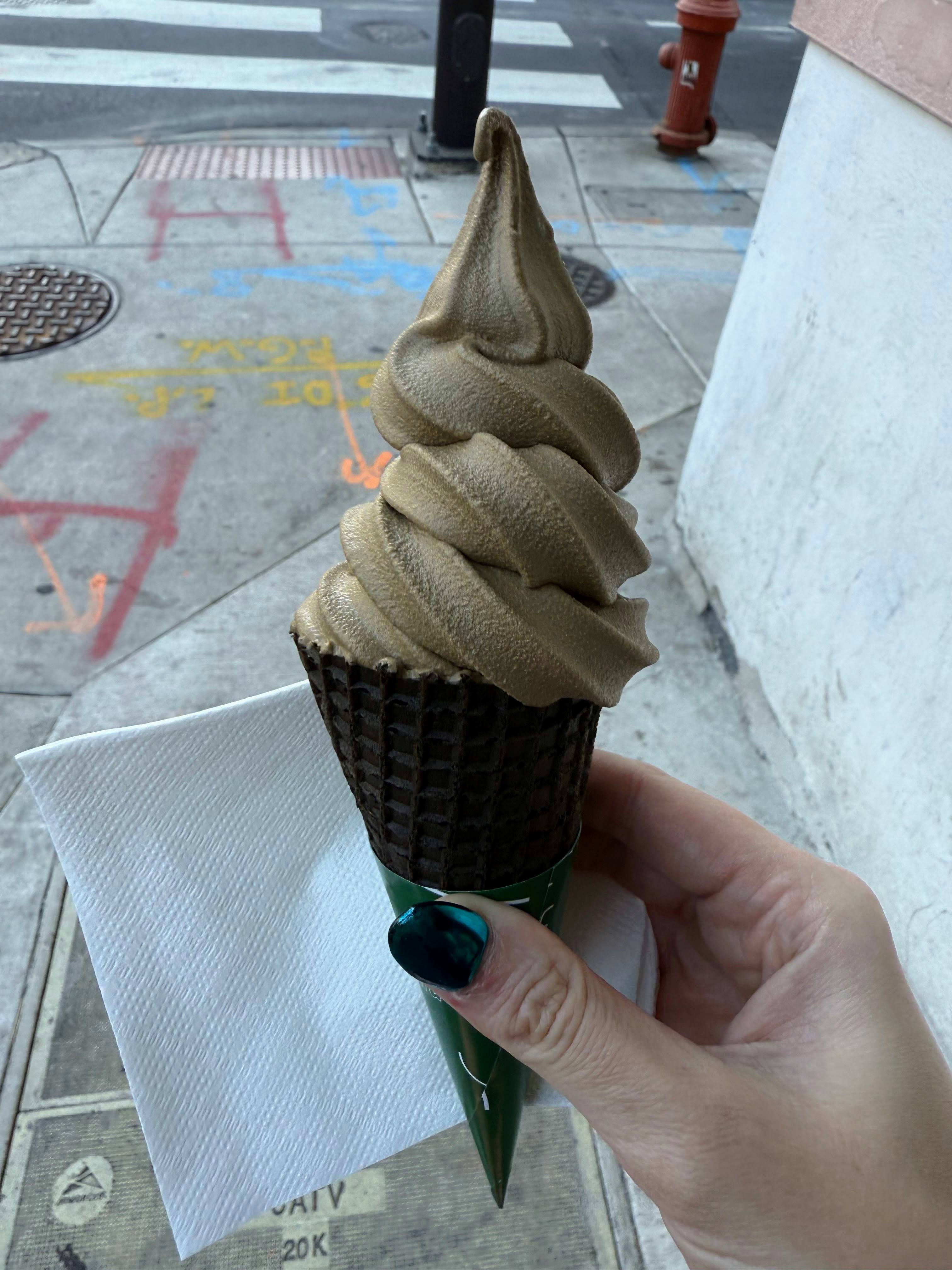 Matcha ice cream cone from Matcha Panda under the autumn sun.