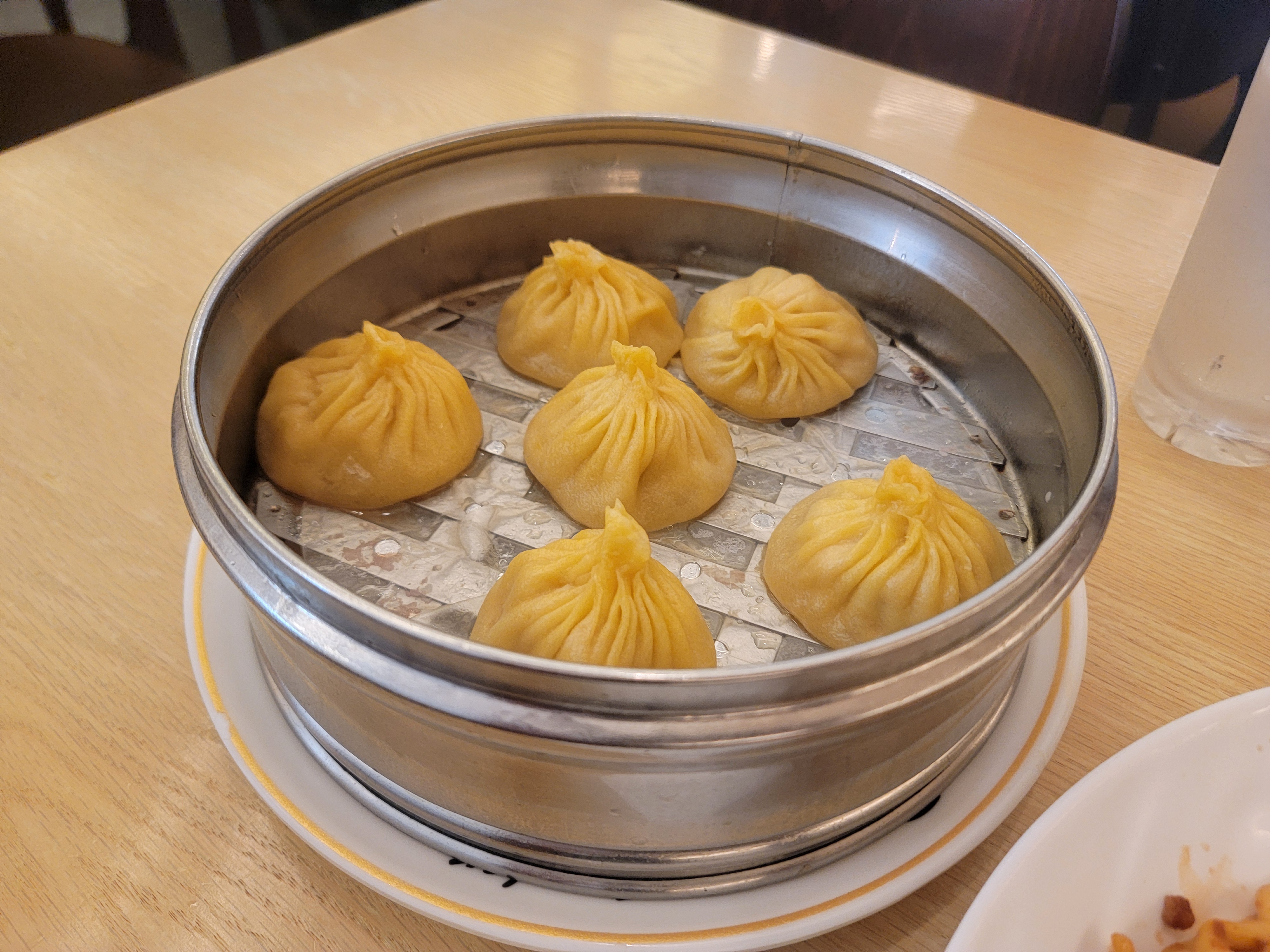 Close-up of xiao long bao inside the steamer.
